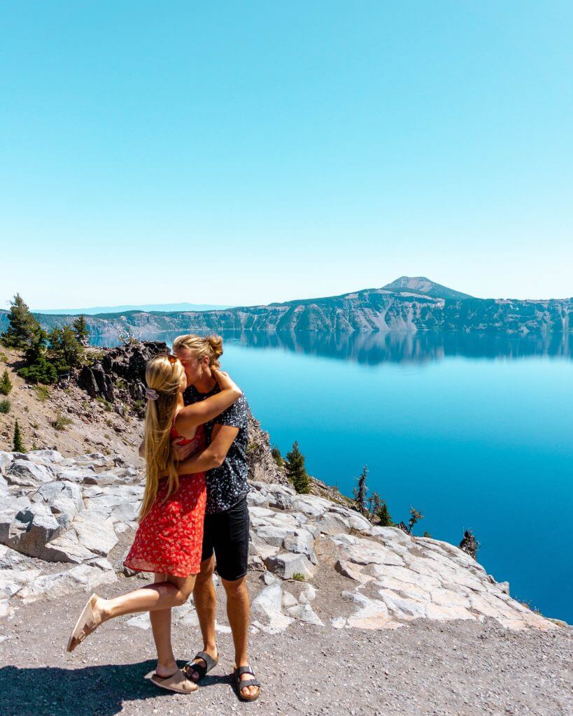 A couple kissing at Crater Lake in Oregon.