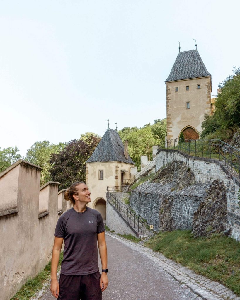 Boy exploring around Karlstejn Castle in the Czech Republic.