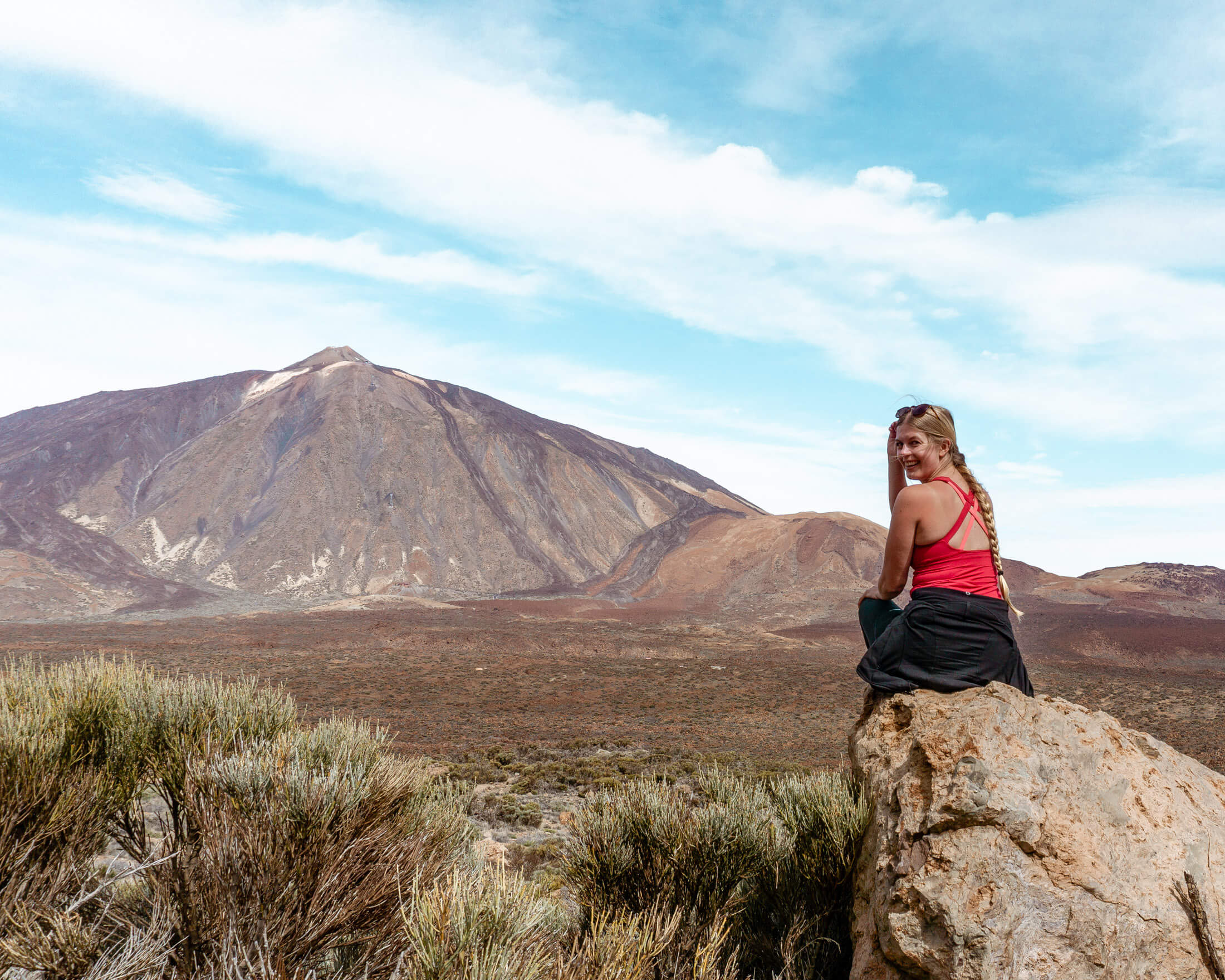 Jo relaxing on a mountain with views of El Teide.