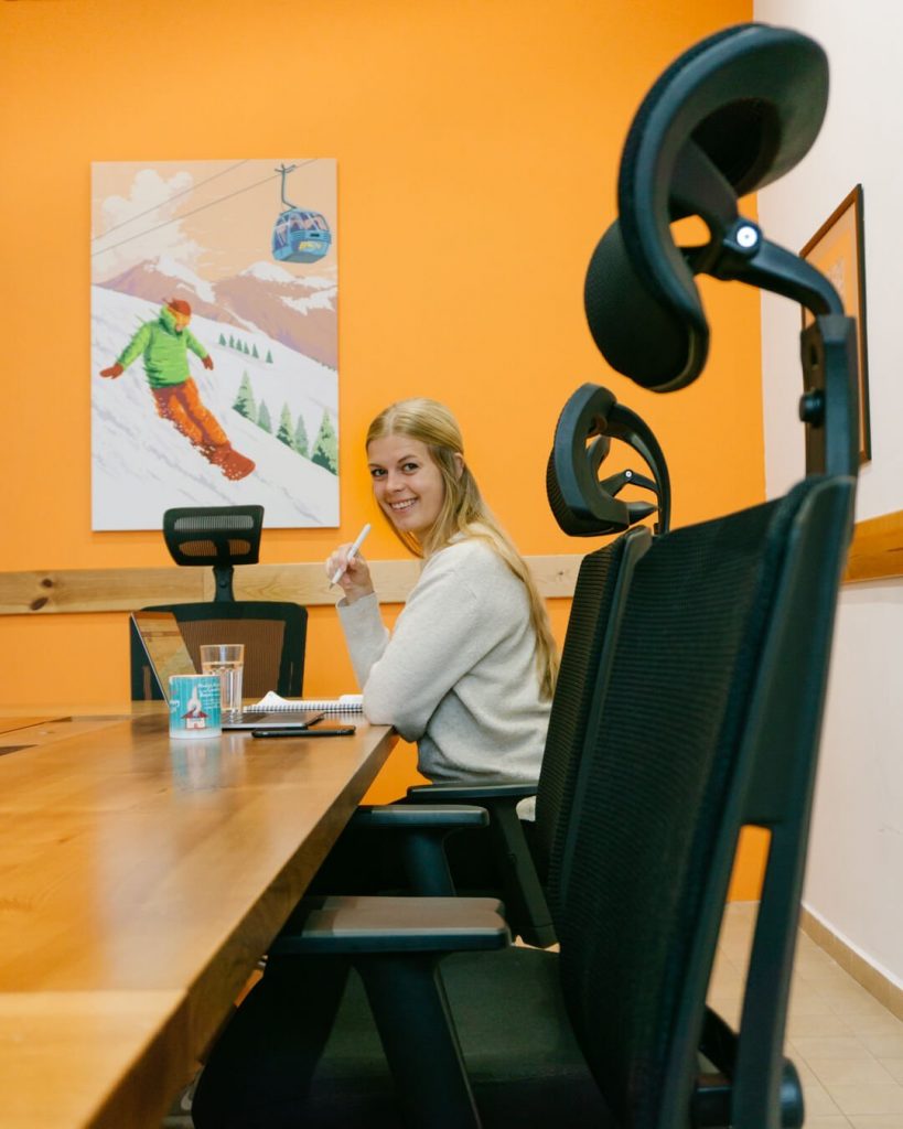 A girl working in a coworking space in Bansko at Coworking Bansko.