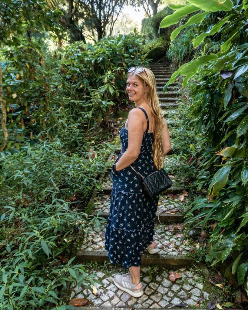A girl walking up stairs in a park.