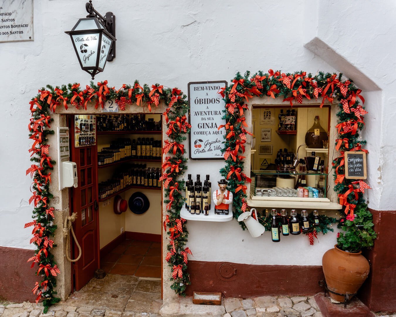 Christmas decorations in front of a store in Óbidos, Portugal.