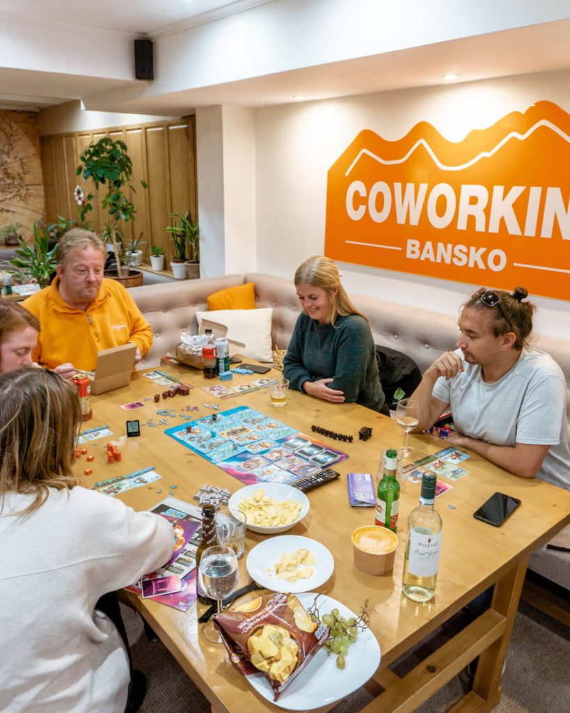 A group of people playing boardgames at Coworking Bansko.