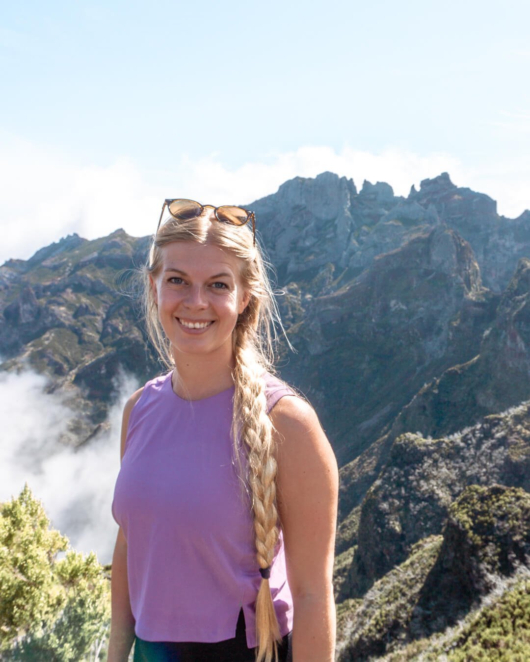 A girl posing for a picture along the Pico do Arieiro trail in Madeira.