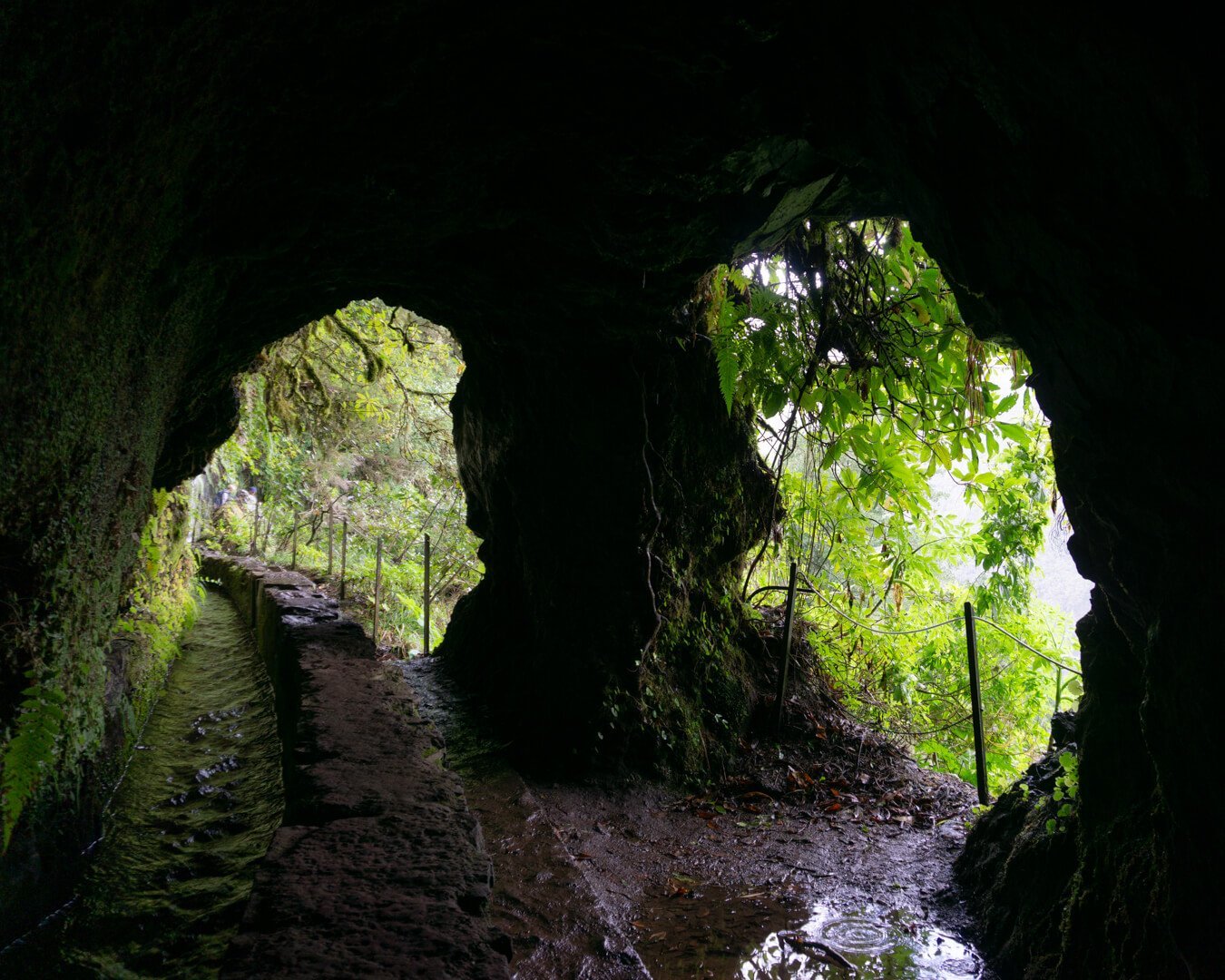 View from inside a tunnel along the PR 9 Caldeirão Verde in Madeira.