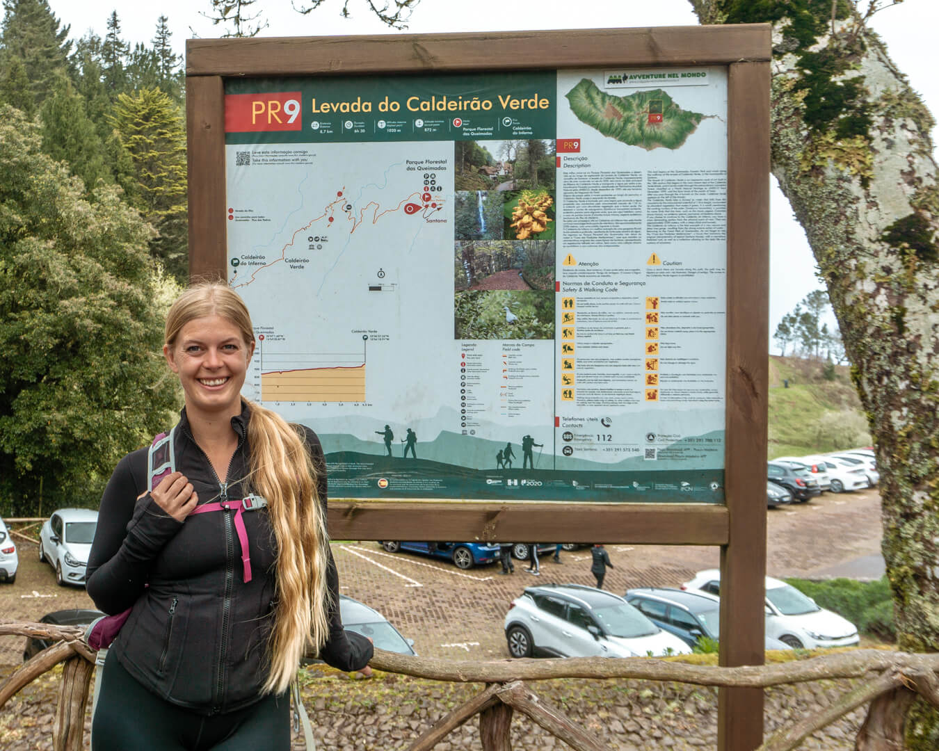 Photo of a girl standing in front of the PR9 Levada do Caldeirão Verde sign.