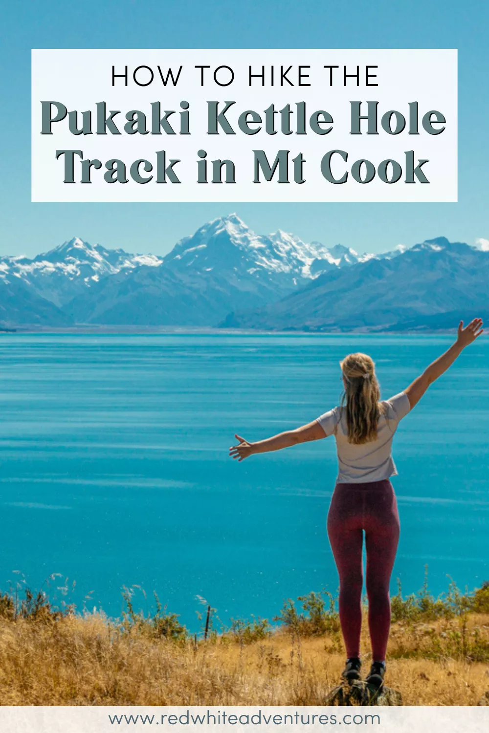 A woman with arms outstretched stands on a grassy hill overlooking Lake Pukaki and Mount Cook, celebrating the view on a clear day, with text that reads "How to Hike the Pukaki Kettle Hole Track in Mt Cook".