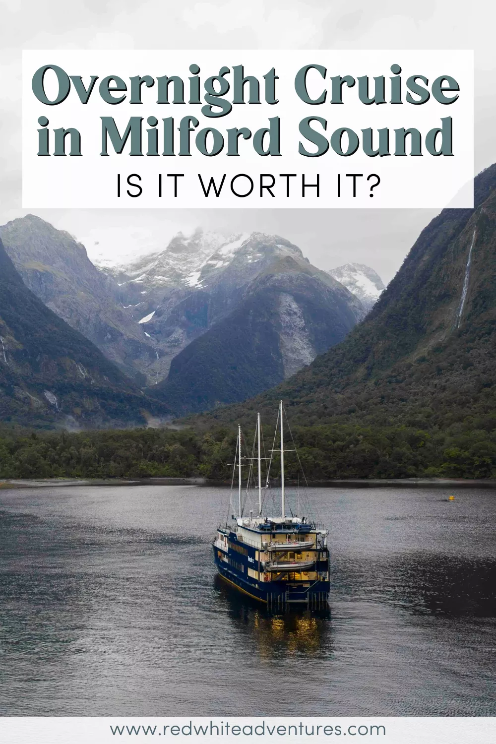 A blue overnight cruise boat floats in the calm waters of Milford Sound, surrounded by towering green cliffs and distant snow-capped mountains, with bold text above reading "Overnight Cruise in Milford Sound – Is it worth it?".