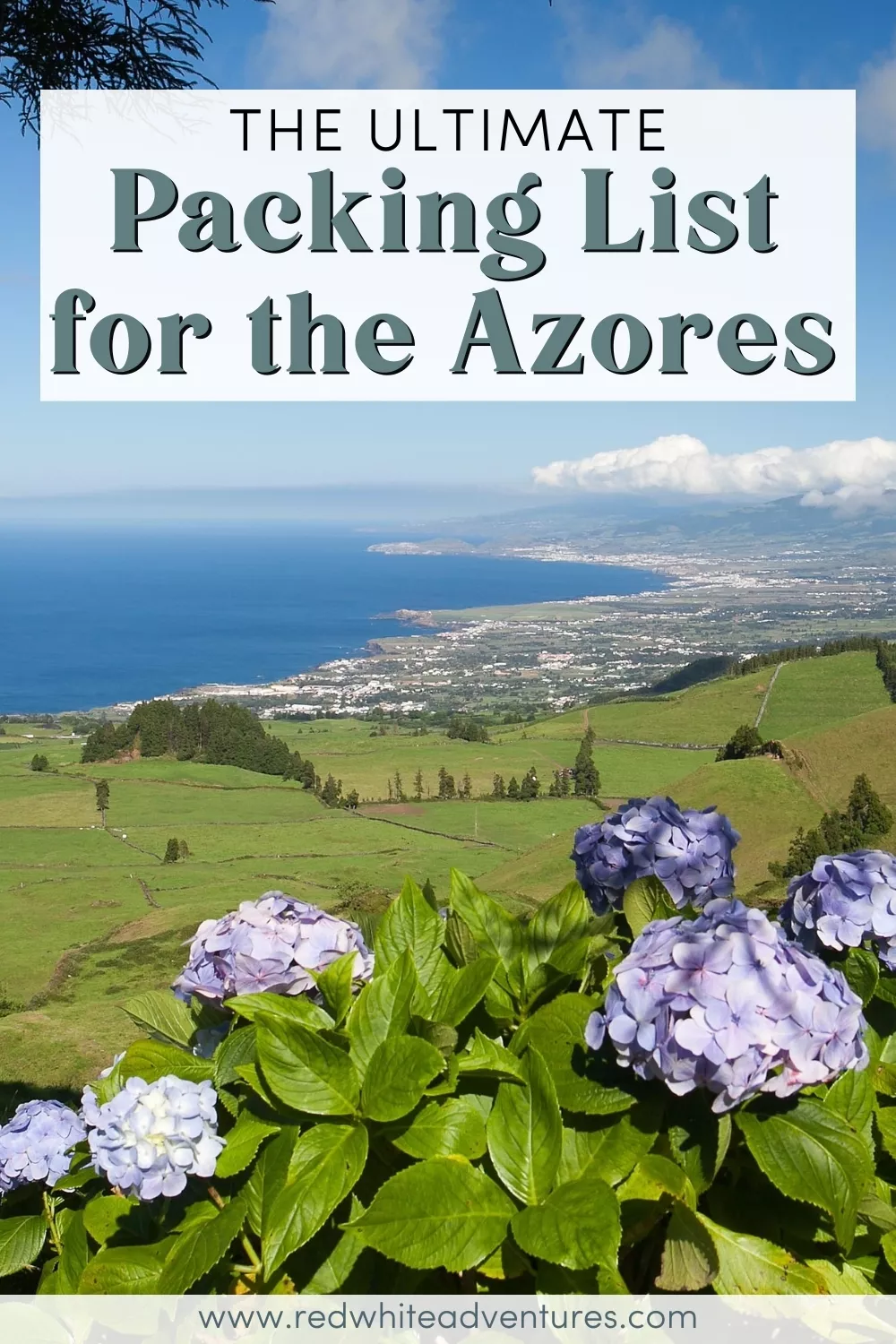 Purple hydrangeas bloom in the foreground overlooking the coastal city of Ponta Delgada and rolling green hills under a clear sky. Text overlay reads “The Ultimate Packing List for the Azores.”