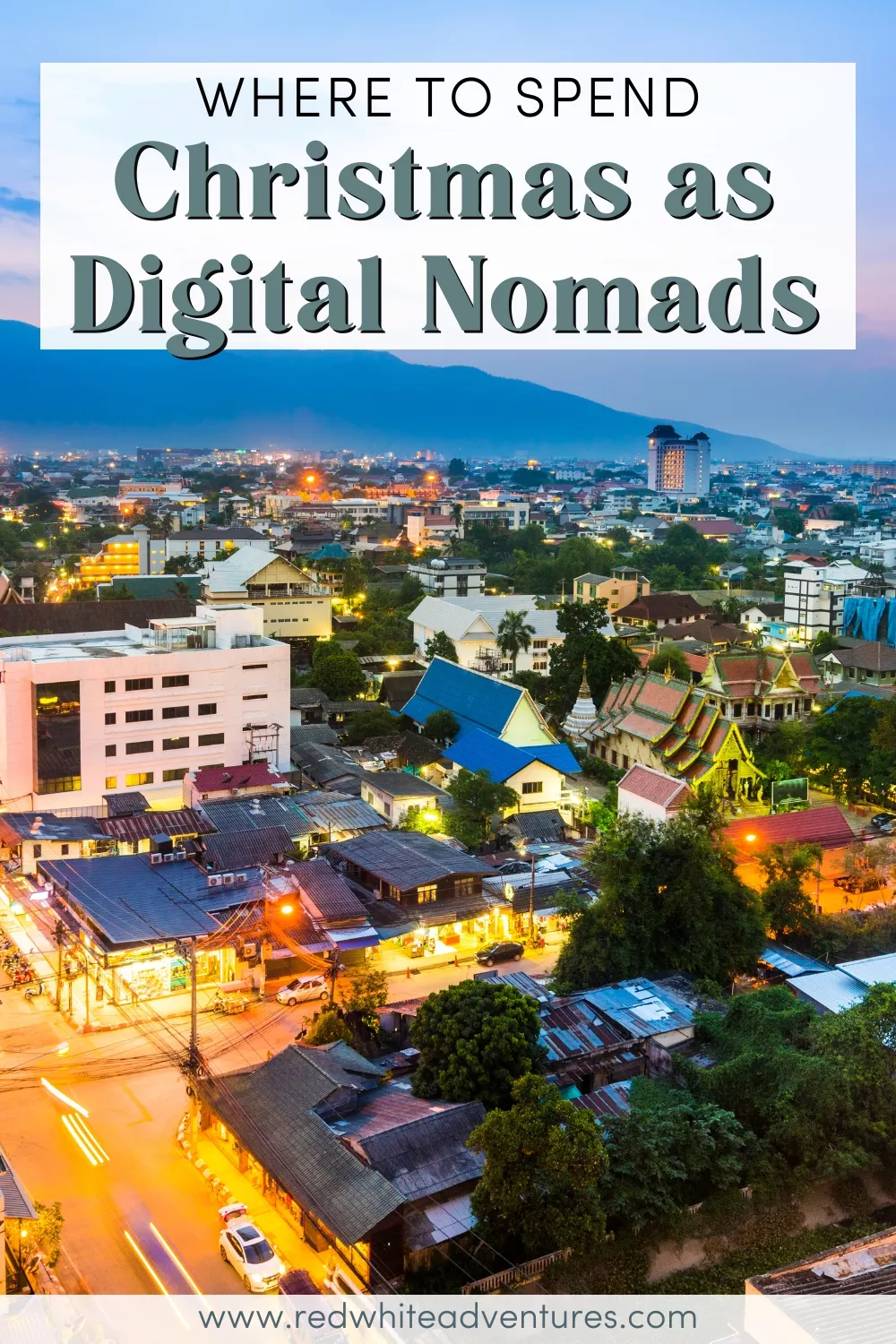 Evening cityscape of Chiang Mai, Thailand, with glowing streetlights, temples, and surrounding mountains, overlaid with the text “Where to Spend Christmas as Digital Nomads.”