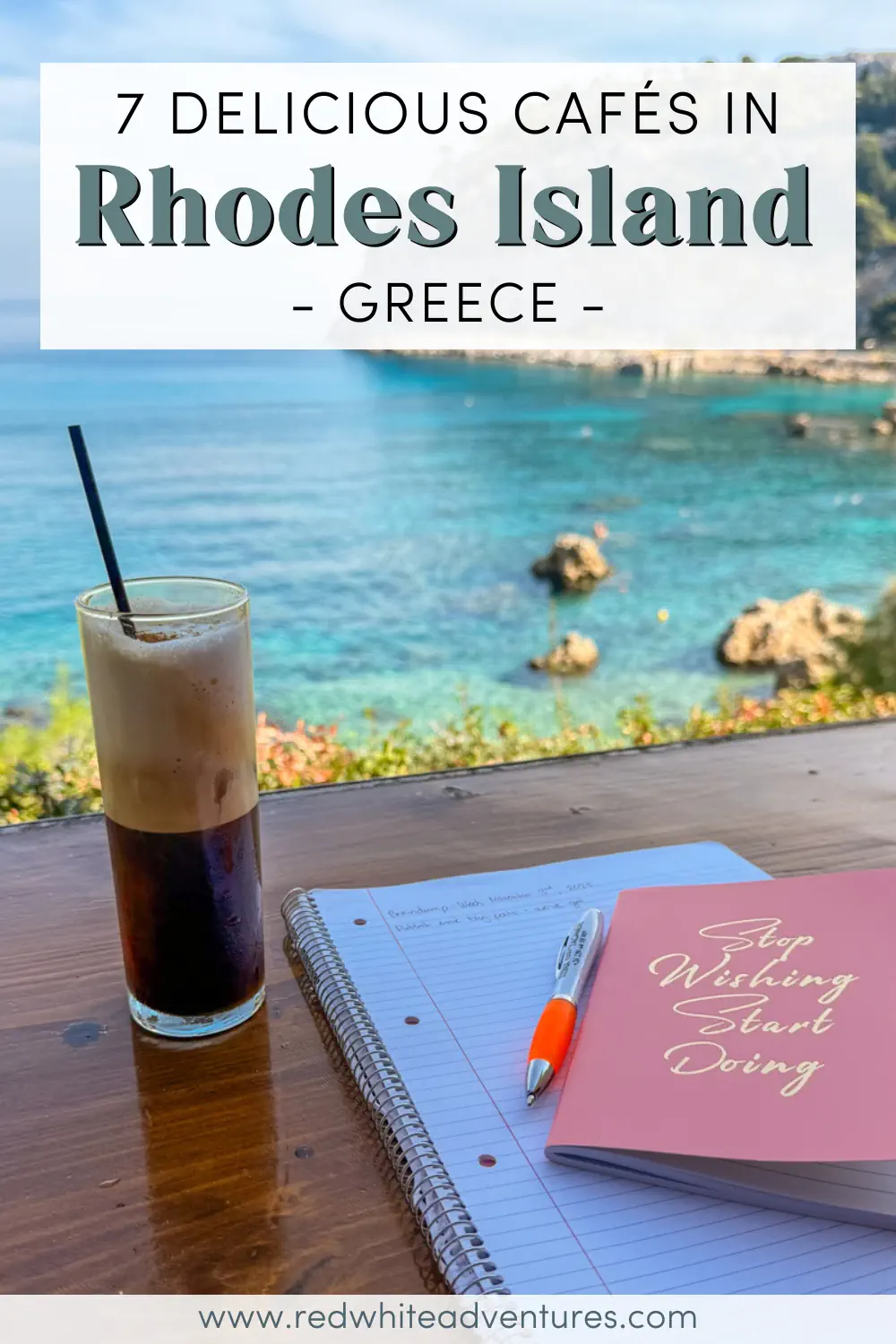 An iced coffee, an open notebook with writing, and a pink journal that says “Stop Wishing Start Doing” rest on a wooden table with a view of the clear blue sea in Rhodes. The overlay text says “7 Delicious Cafés in Rhodes Island – Greece.”