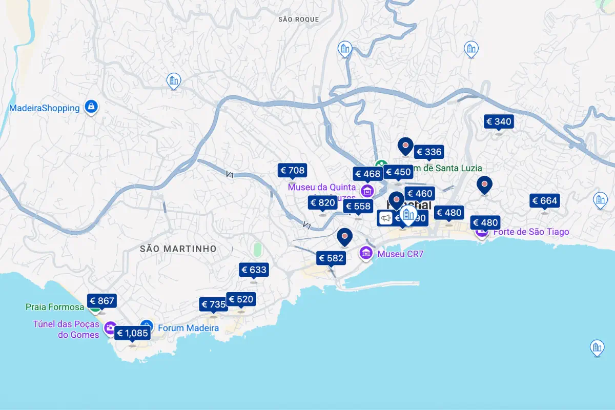 A map of Funchal, Madeira shows hotel price markers in euros scattered across the city and along the coastline. Prices range from around €336 to over €1,000, with landmarks such as Praia Formosa, Museu CR7, and Forte de São Tiago visible on the map.