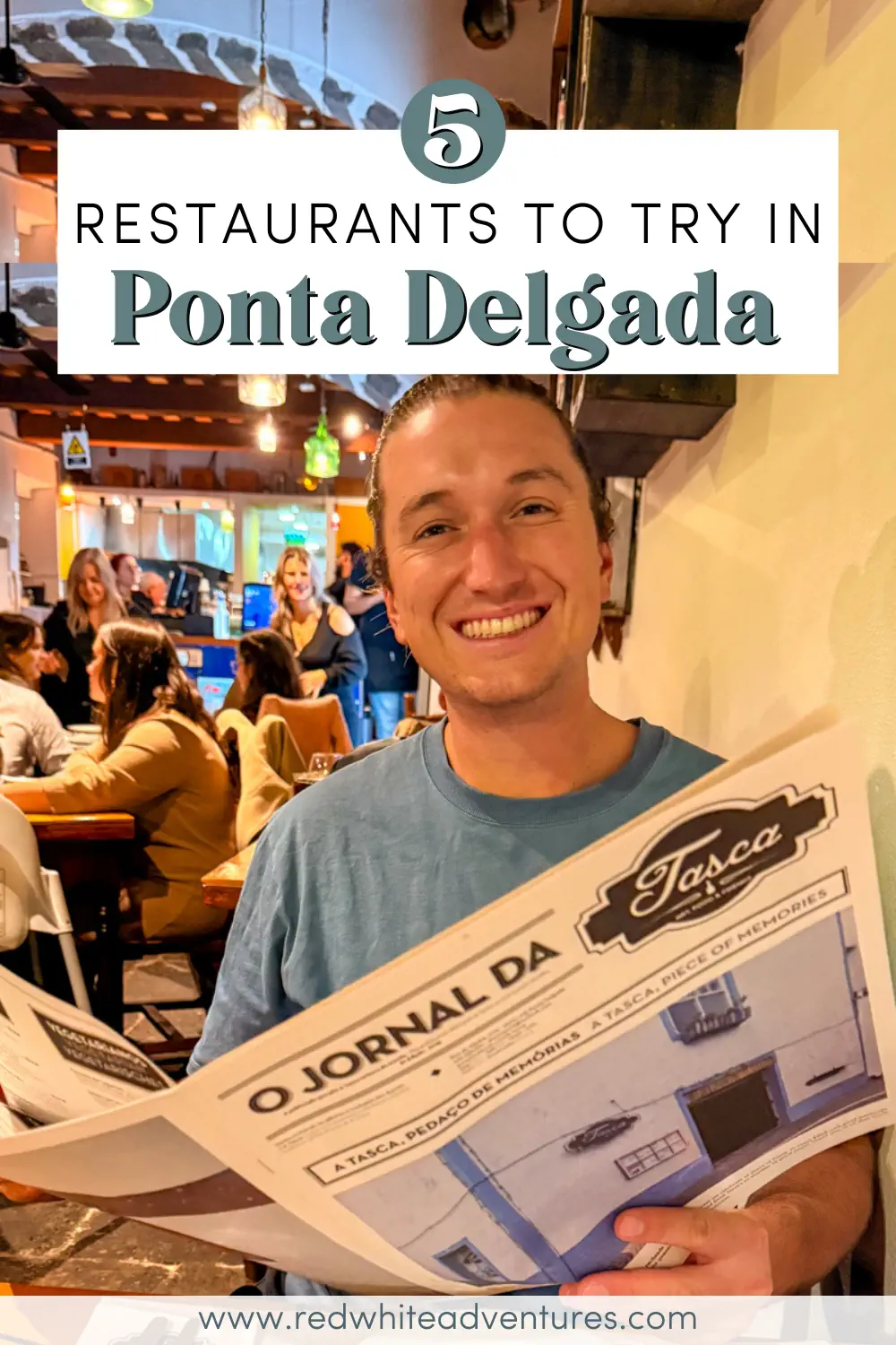 A smiling man sits inside a busy restaurant holding a newspaper menu while other diners sit at tables behind him. Text over the image reads “5 Restaurants to Try in Ponta Delgada.”