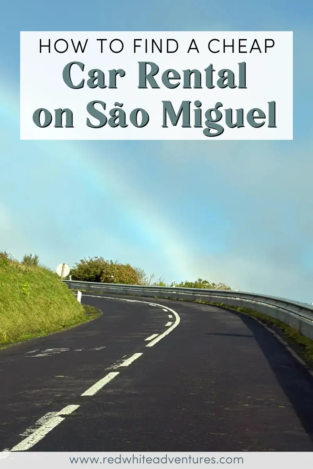 A winding paved road curves through green hills on São Miguel Island, with a faint rainbow visible in the blue sky above. Text overlay reads, “How to Find a Cheap Car Rental on São Miguel.”