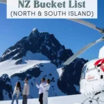 A group of travellers stands on a snowy glacier beside a helicopter with dramatic alpine peaks behind them. Text reads 12 Things For Your NZ Bucket List North and South Island.