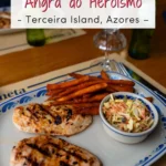 Grilled chicken with sweet potato fries and coleslaw served on a plate with the text “5 great restaurants in Angra do Heroísmo - Terceira Island, Azores -” overlaid at the top of the image.
