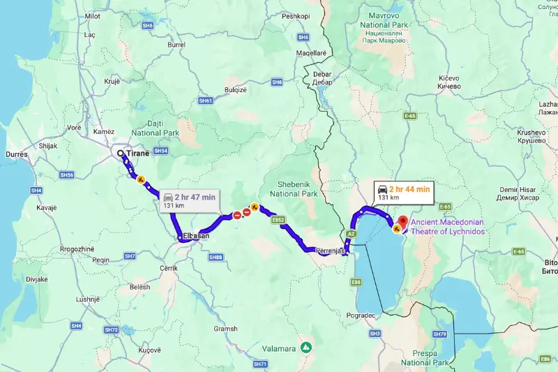 Google Maps route showing the drive from Tirana, Albania to Ohrid, North Macedonia around Lake Ohrid. The map highlights a 131 kilometer route through Elbasan and Përrenjas with an estimated travel time of about 2 hours and 45 minutes.