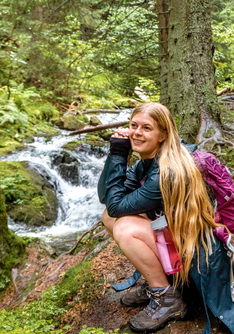 Jo admiring the view of the waterfall while hiking in Karlova Studanka.