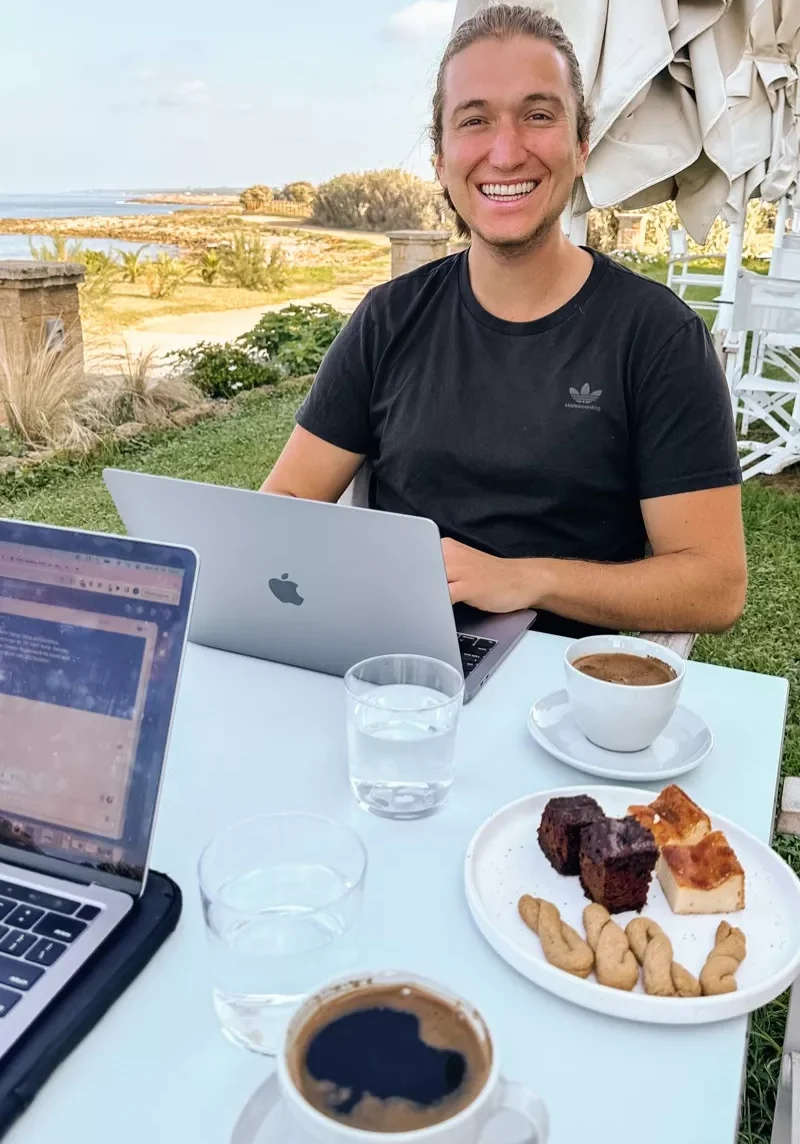 Dom enjoying the view with his breakfast in Marathopoli, Greece.