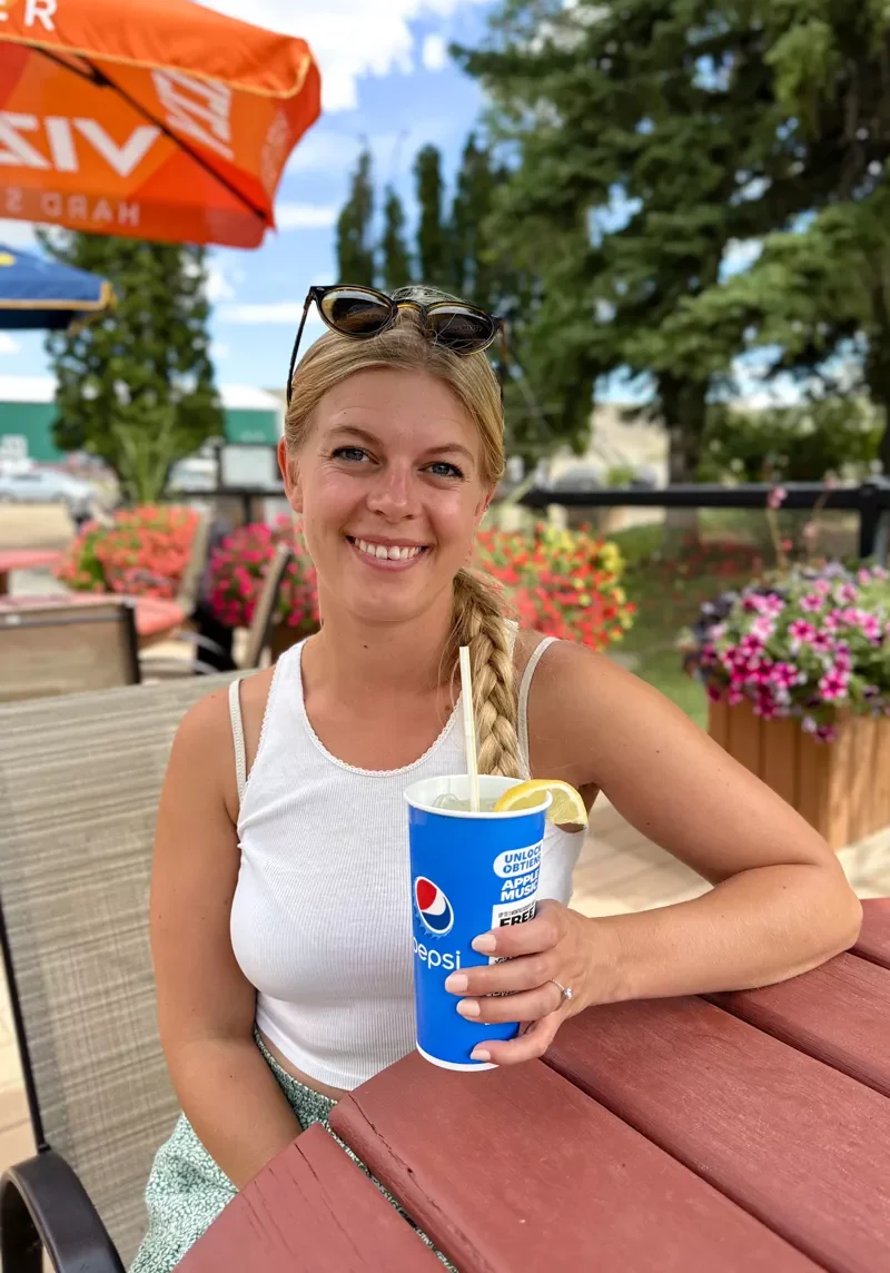 Jo enjoying a soda at the Drumheller golf course restaurant.
