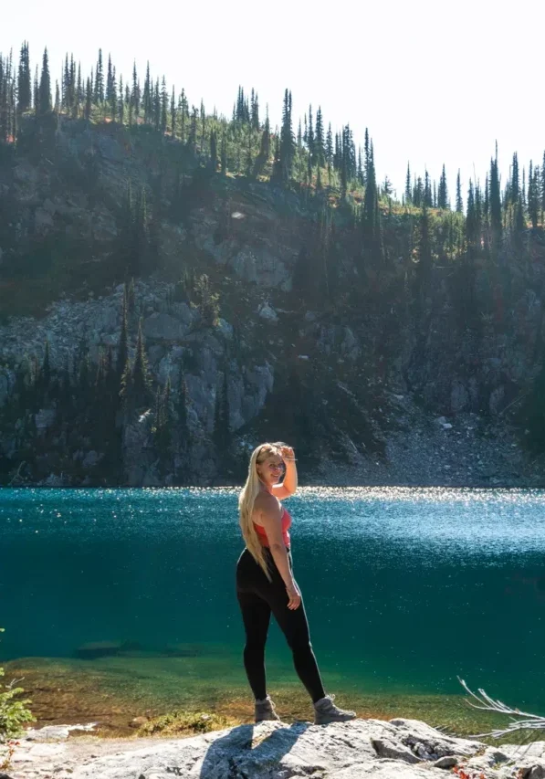 Jo smiling for a photo at Miller Lake in Revelstoke National Park.