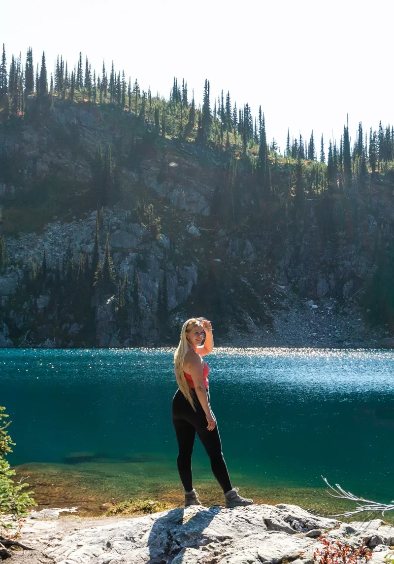 Jo smiling for a photo at Miller Lake in Revelstoke National Park.