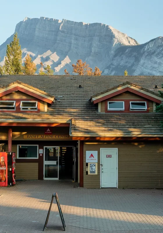 View from outside the HI Banff Alpine Centre with a beautiful mountain backdrop.