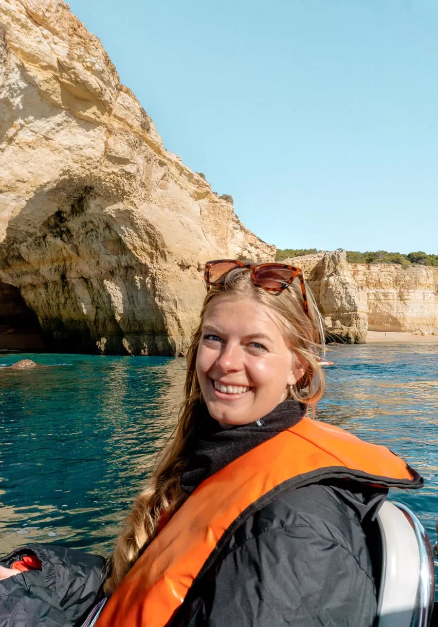 A girl sitting on a speed boat to the Benagil Caves near Lagos.