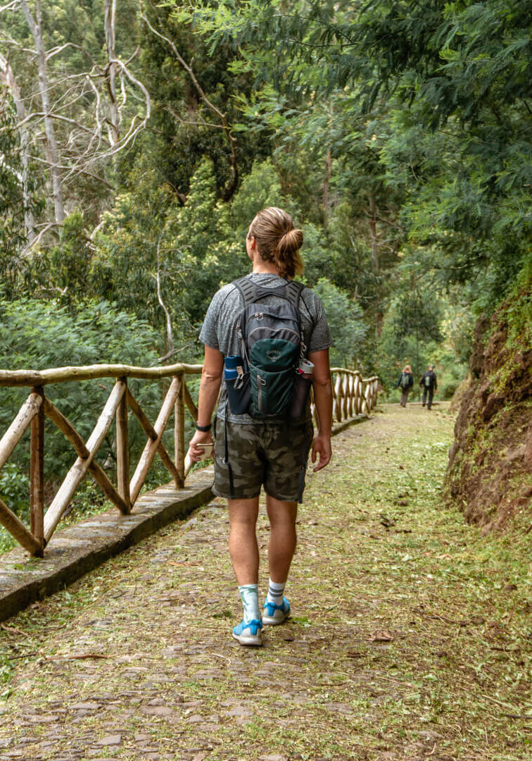 A guy hiking on a levada trail near Funchal.
