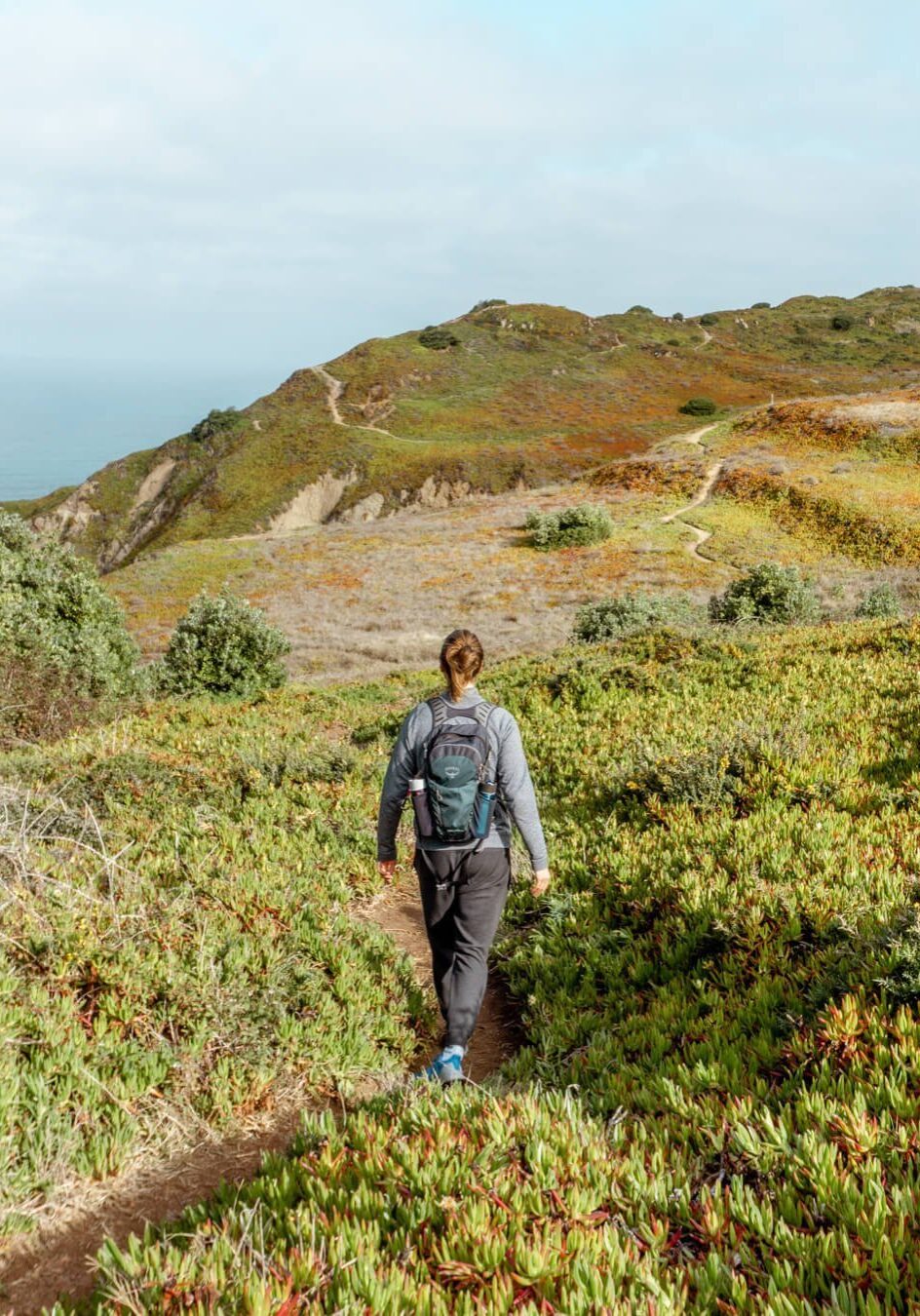 A man hiking along the Portuguese coast near Cabo da Roca.