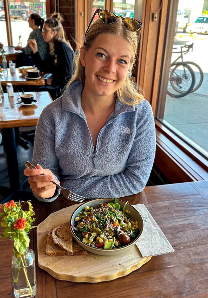 Jo eating a delicious meal at Terra Firmas Kitchen and Cafe in Revelstoke!