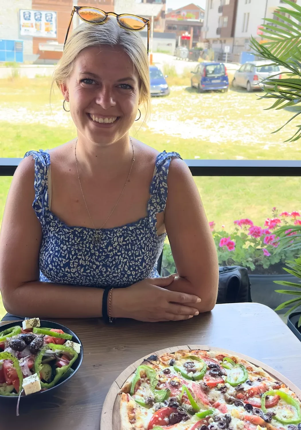 Jo eating a delicious pizza at The Station Lunch in Bansko.