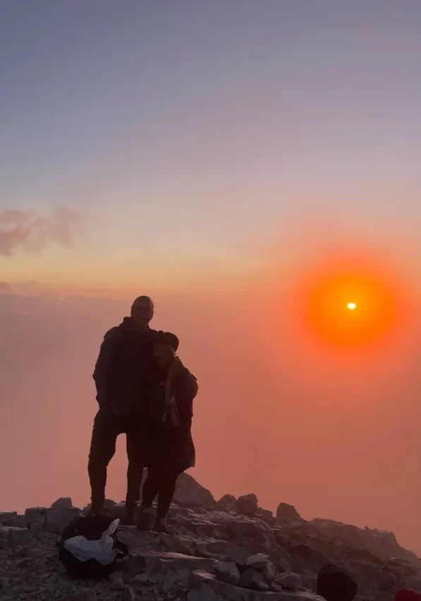 Dom and Jo enjoying the sunrise from Vihren Peak.