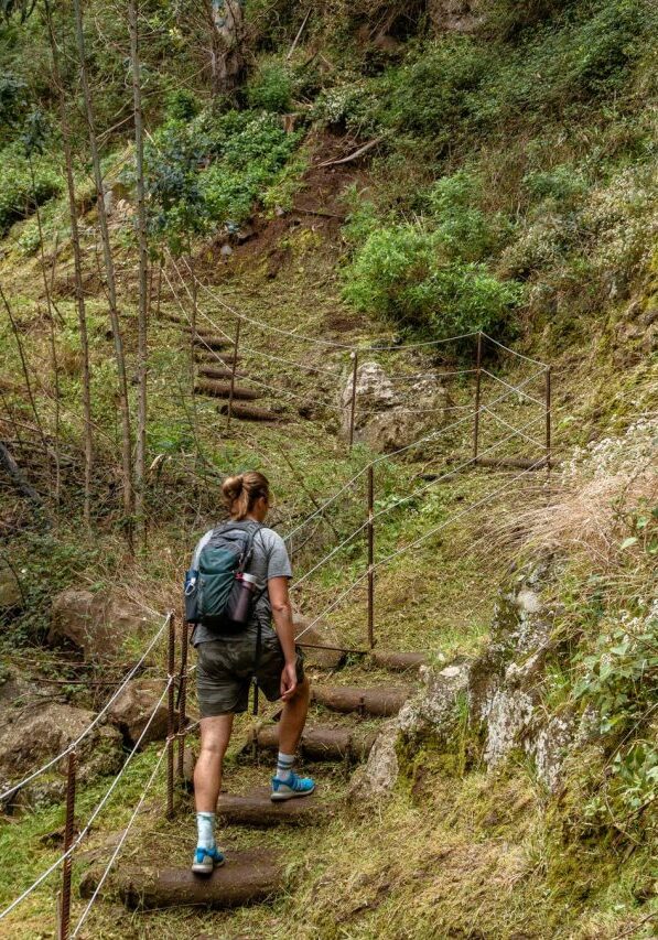 A guy hiking the levada do Bom Sucesso.