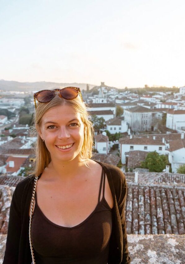 A girl standing at a viewpoint in Óbidos Castle