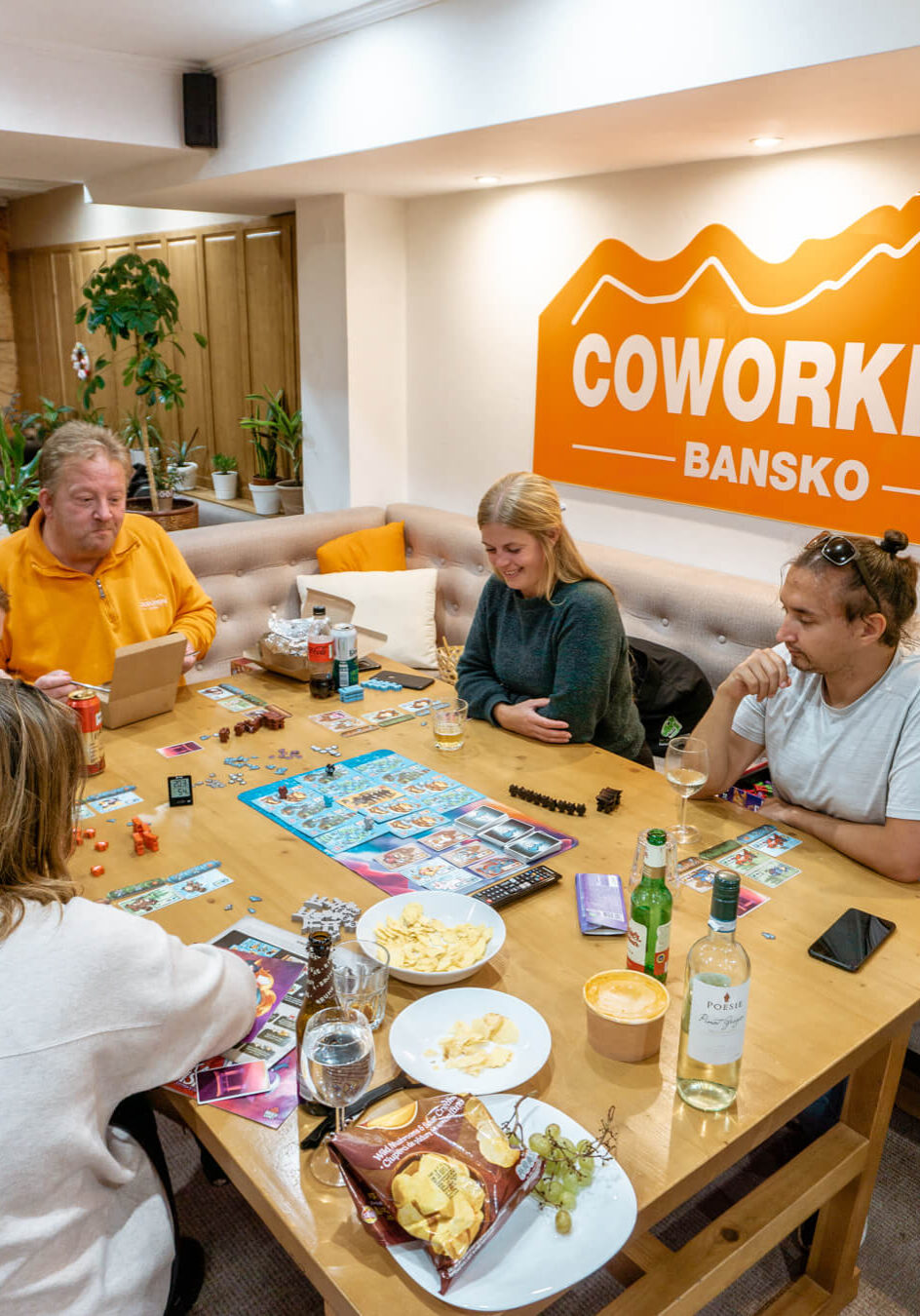 A group of people playing boardgames at Coworking Bansko.