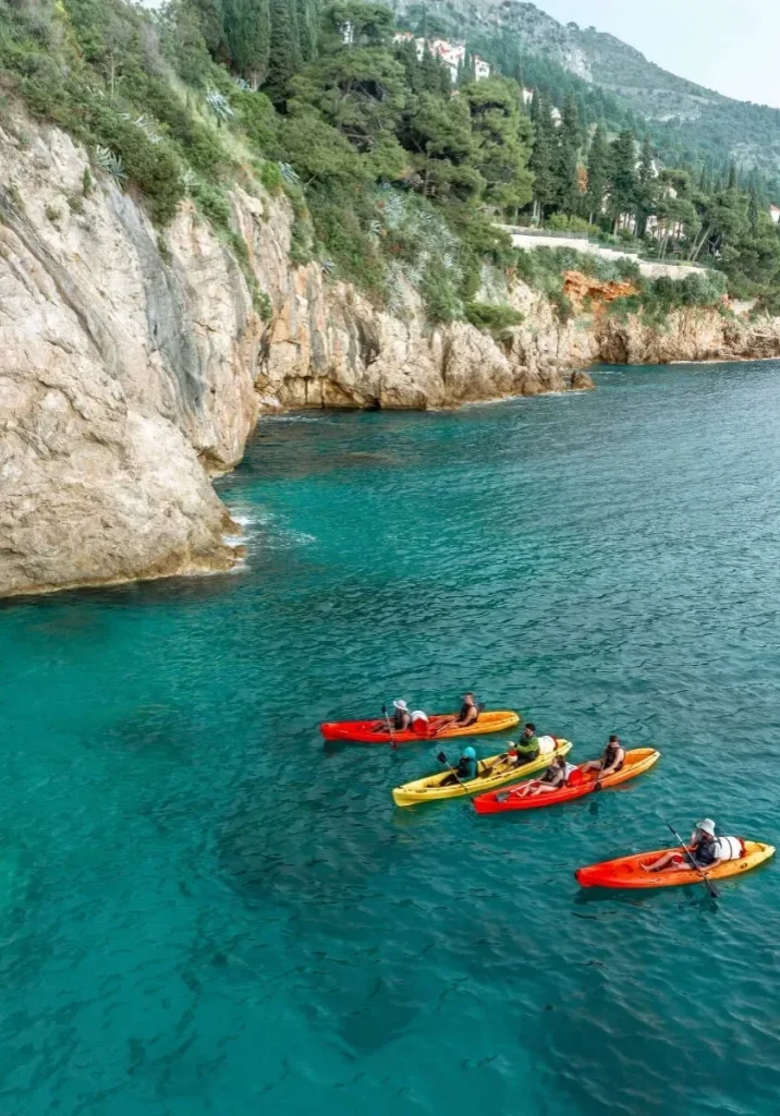4 kayaks out on the water in Dubrovnik.